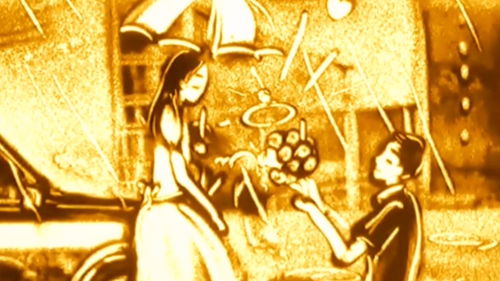 用沙画记录完美爱情